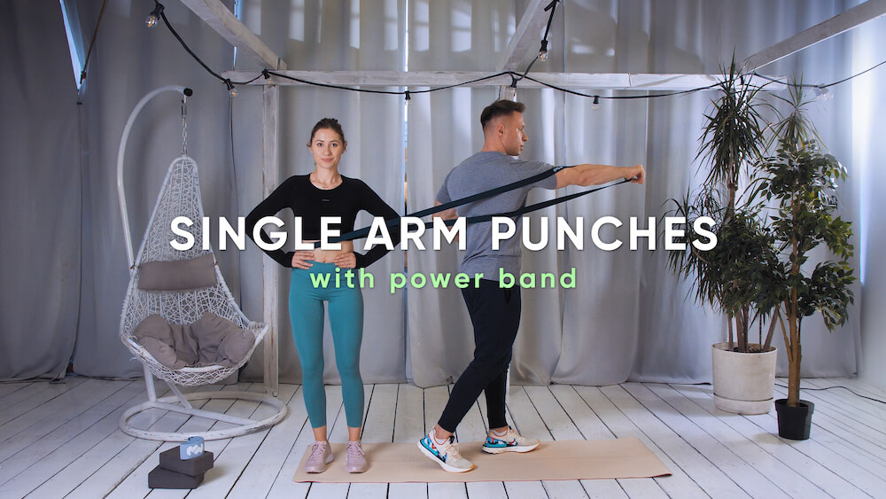 Single arm punches with power band Atlas ćwiczeń Centrum Respo